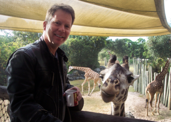 Stephen G. Charpentier with a giraffe